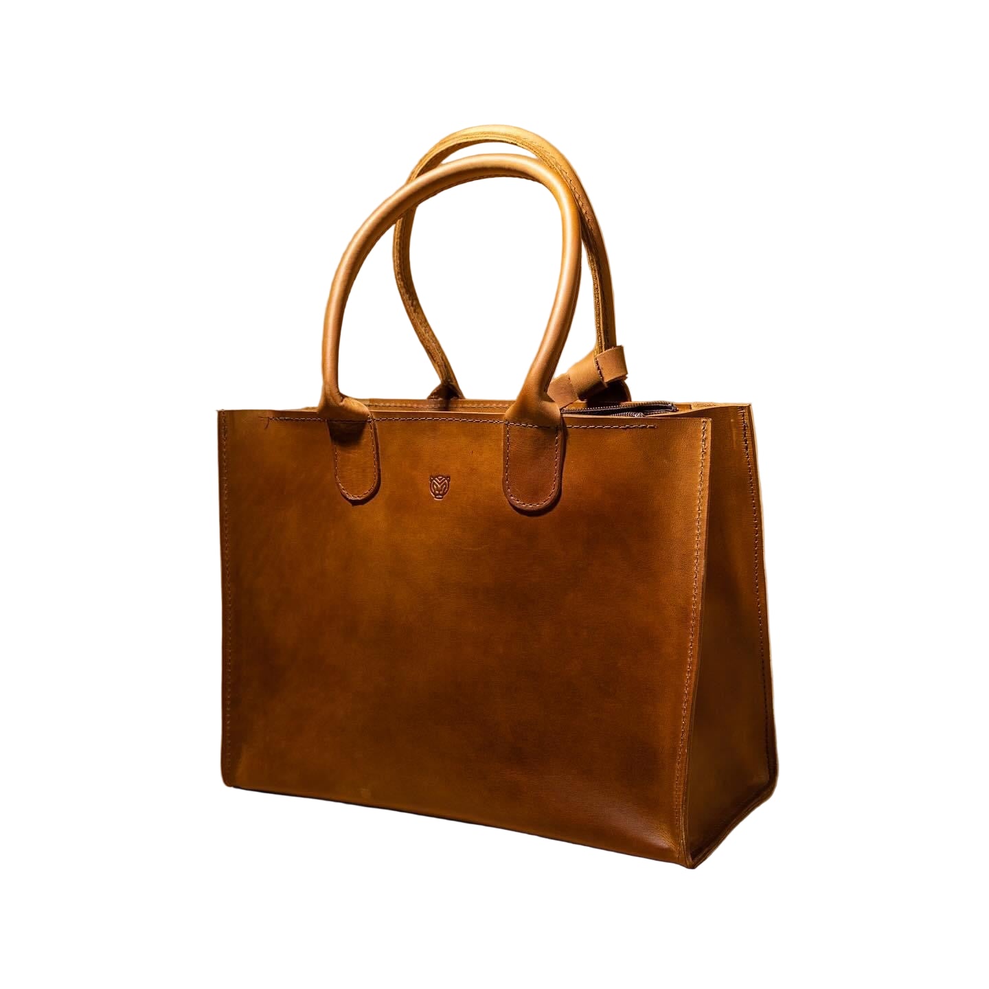 A medium-sized camel brown leather handbag with a secure zip and magnetic closure, featuring two handles and a small matching pouch.