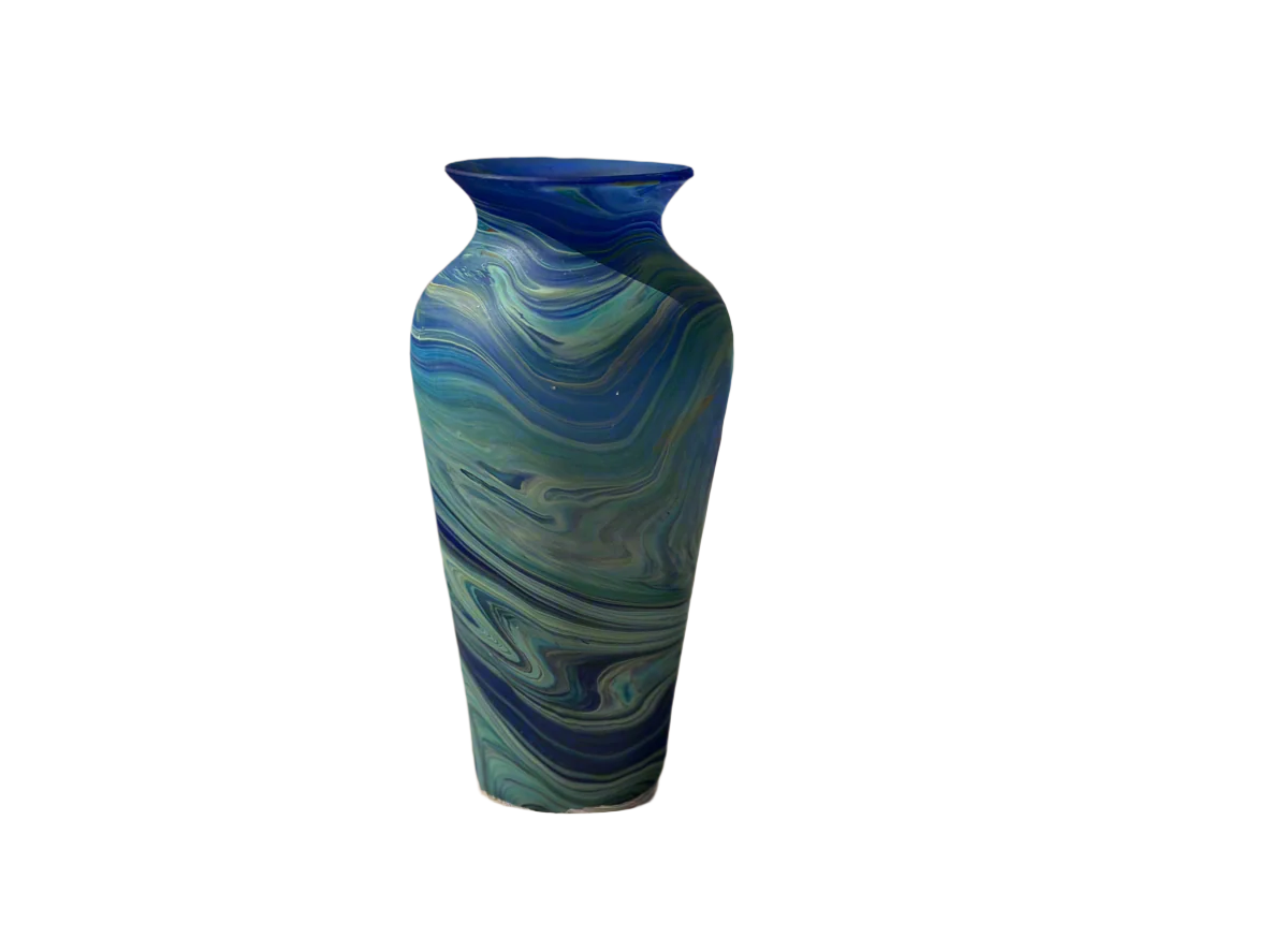 A handblown Phoenician glass vase with blue and green swirls on a plain background.