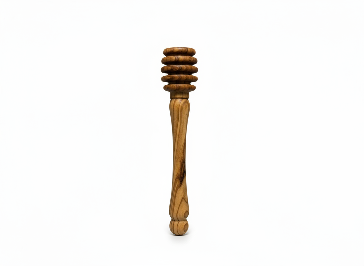 Olive wood honey dipper on a beige background