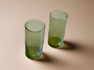 Two green glass tumblers
