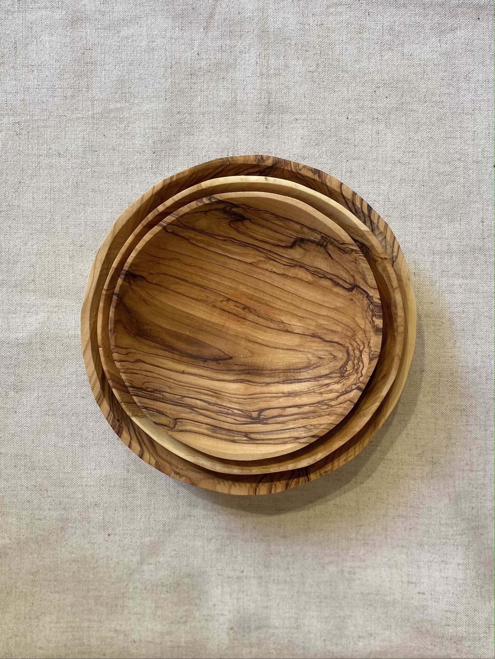 Stacked-set-olive-wood-plates-circles-bethlehem-beit-jala
